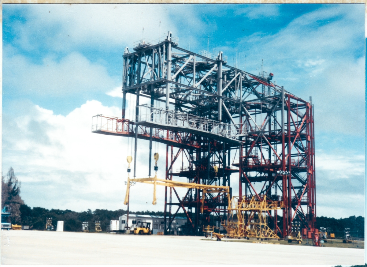 The Mate-Demate Device stands near the south end of the runway at the Shuttle Landing Facility, Kennedy Space Center, Florida. This is the equipment they used to place the orbiter upon, or remove it from, its 747 Carrier Aircraft, which was used to ferry the orbiter cross-country when need arose.